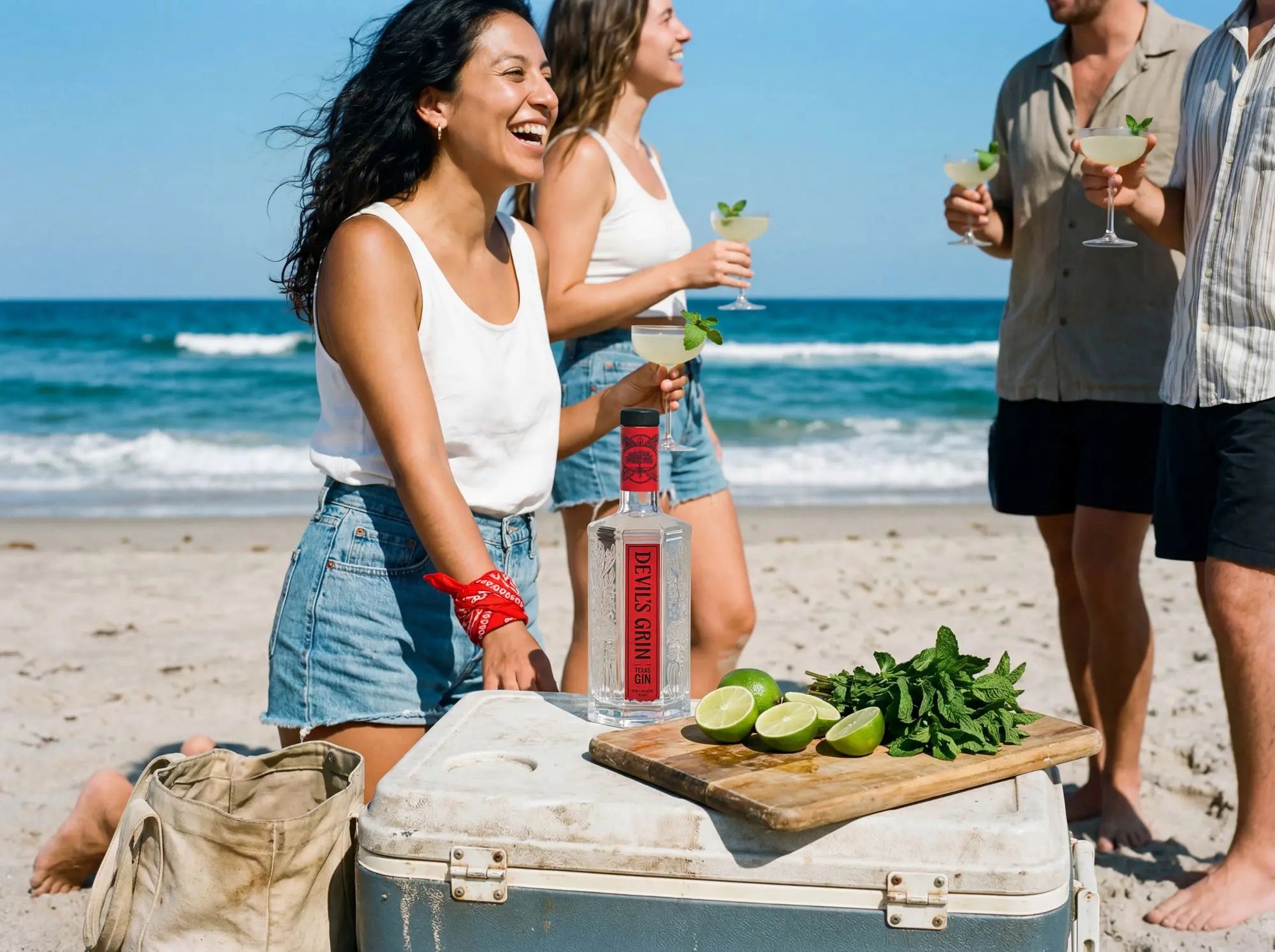 Friends with Devil&rsquo;s Grin cocktails on the beach