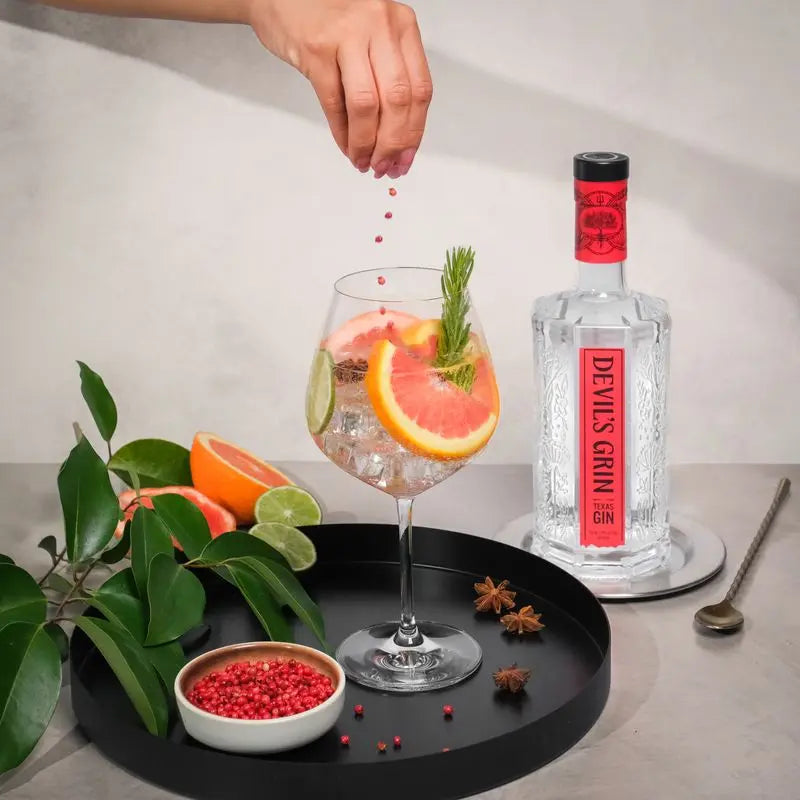 Garnishing a Devil&rsquo;s Grin cocktail by hand