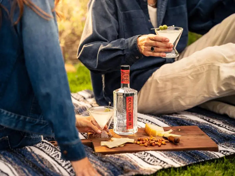 Coupe cocktails on a picnic blanket
